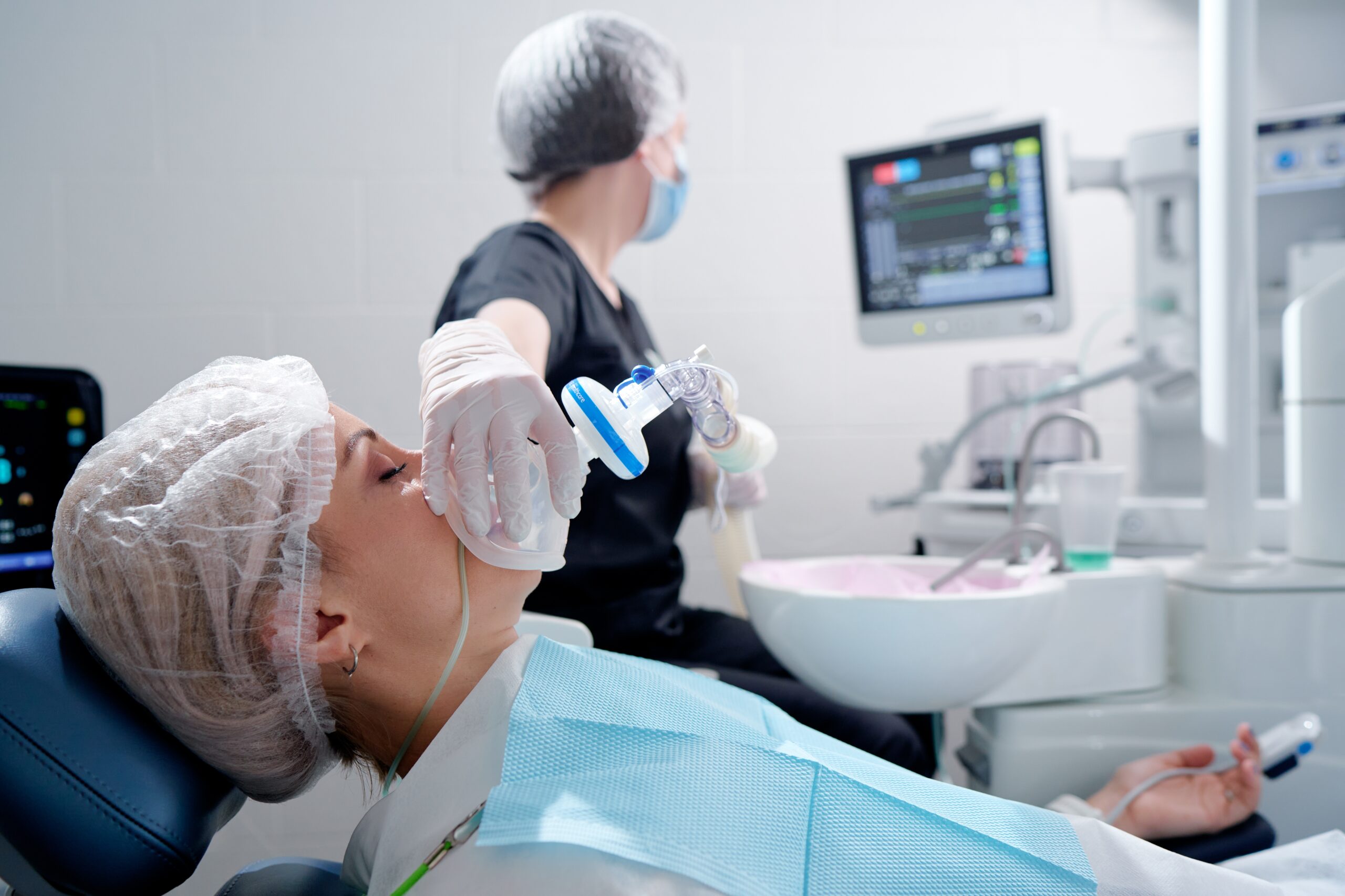 female patient undergoing dental sedation before an upcoming procedure