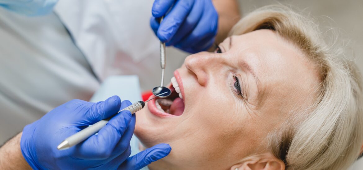Closeup female patient with caries decay visiting doctor, root canal needed