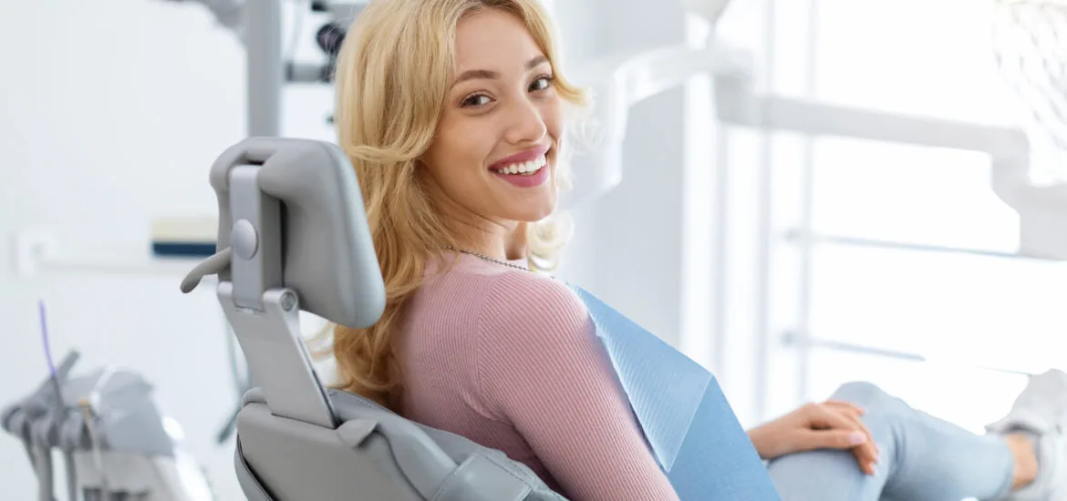 relaxed young woman sitting in a modern dental office