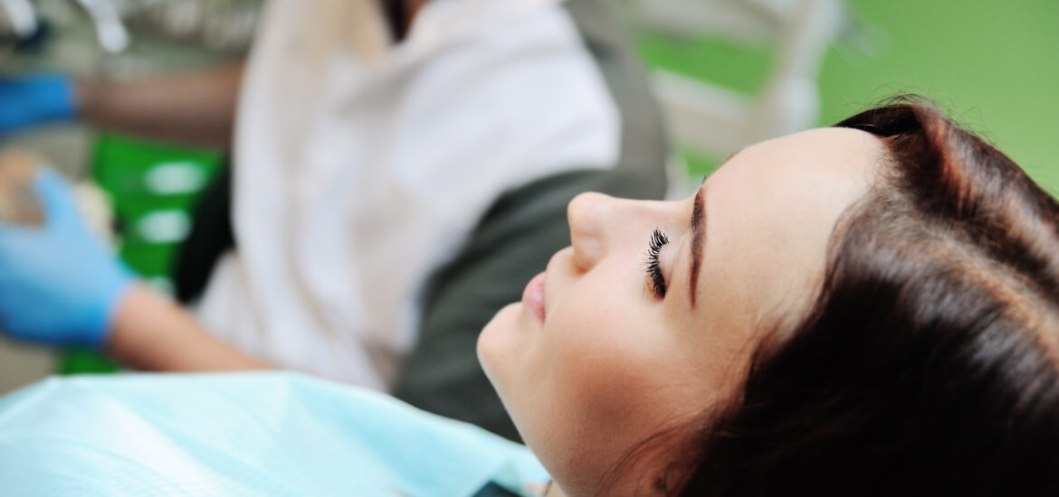 relaxed young girl in a dental chair, sedation dentistry
