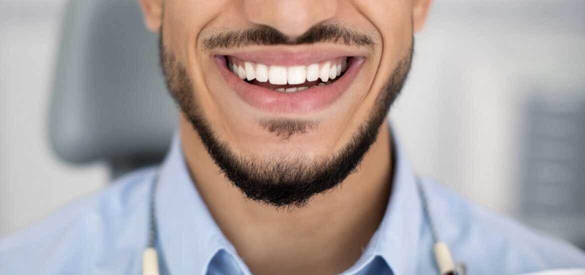 closeup of a mans perfect smile, dental bonding