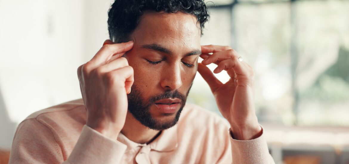 home, headache, and a man in the living room, pain and stress with brain fog, worry and tension.